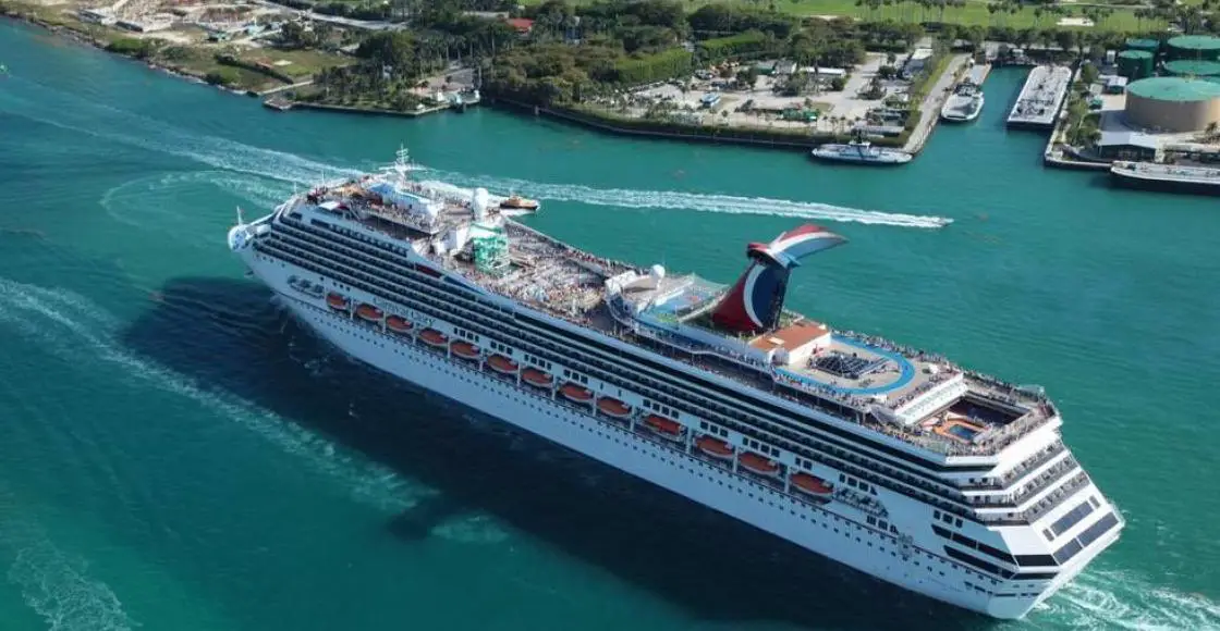 Carnival Glory cruise ship sailing from home port aerial view